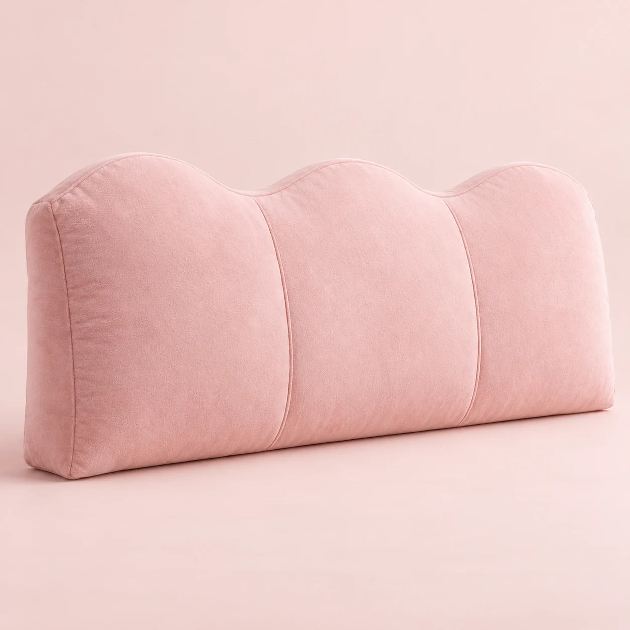 Strawberry Wave, Blush plush wide rectangular bed headboard cushion with three gentle wave lobes along the top, vertical compartment seams