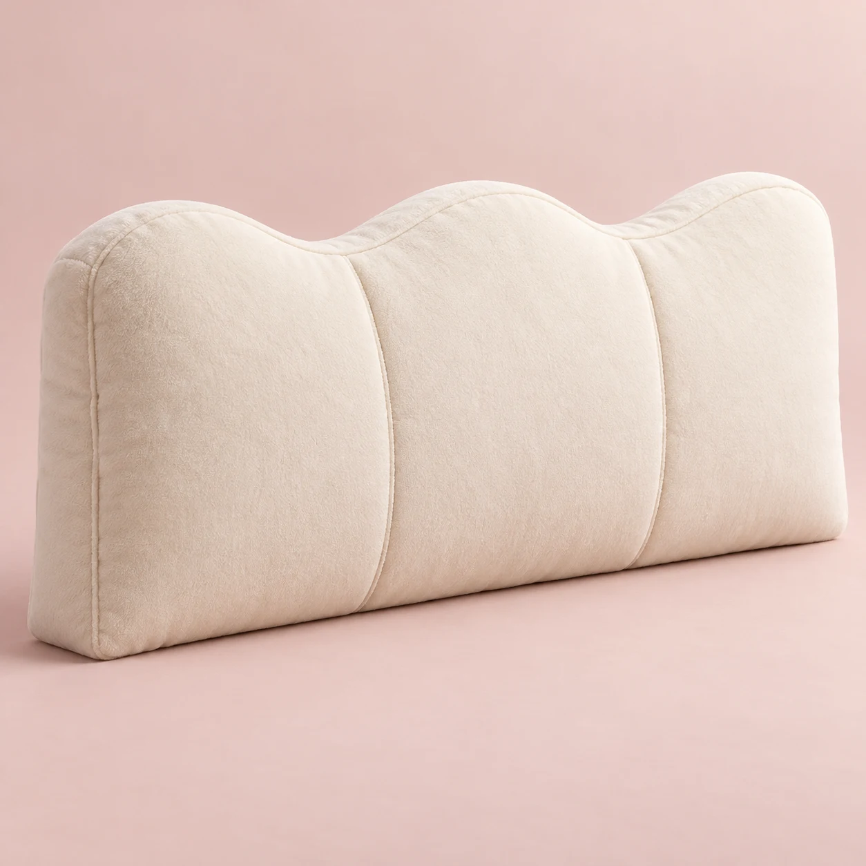 Vanilla Wave, Cream plush wide rectangular bed headboard cushion with three gentle wave lobes along the top, vertical compartment seams