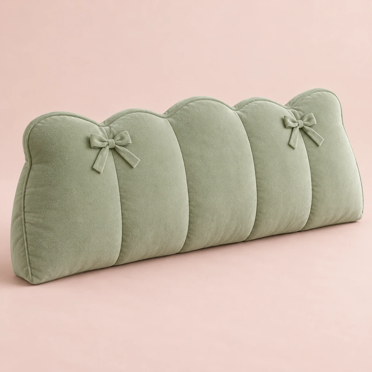 Sage Ribbon, Sage plush wide bed headboard cushion with scalloped top and two small fixed sewn ribbon bows on upper front, vertical compartment seams